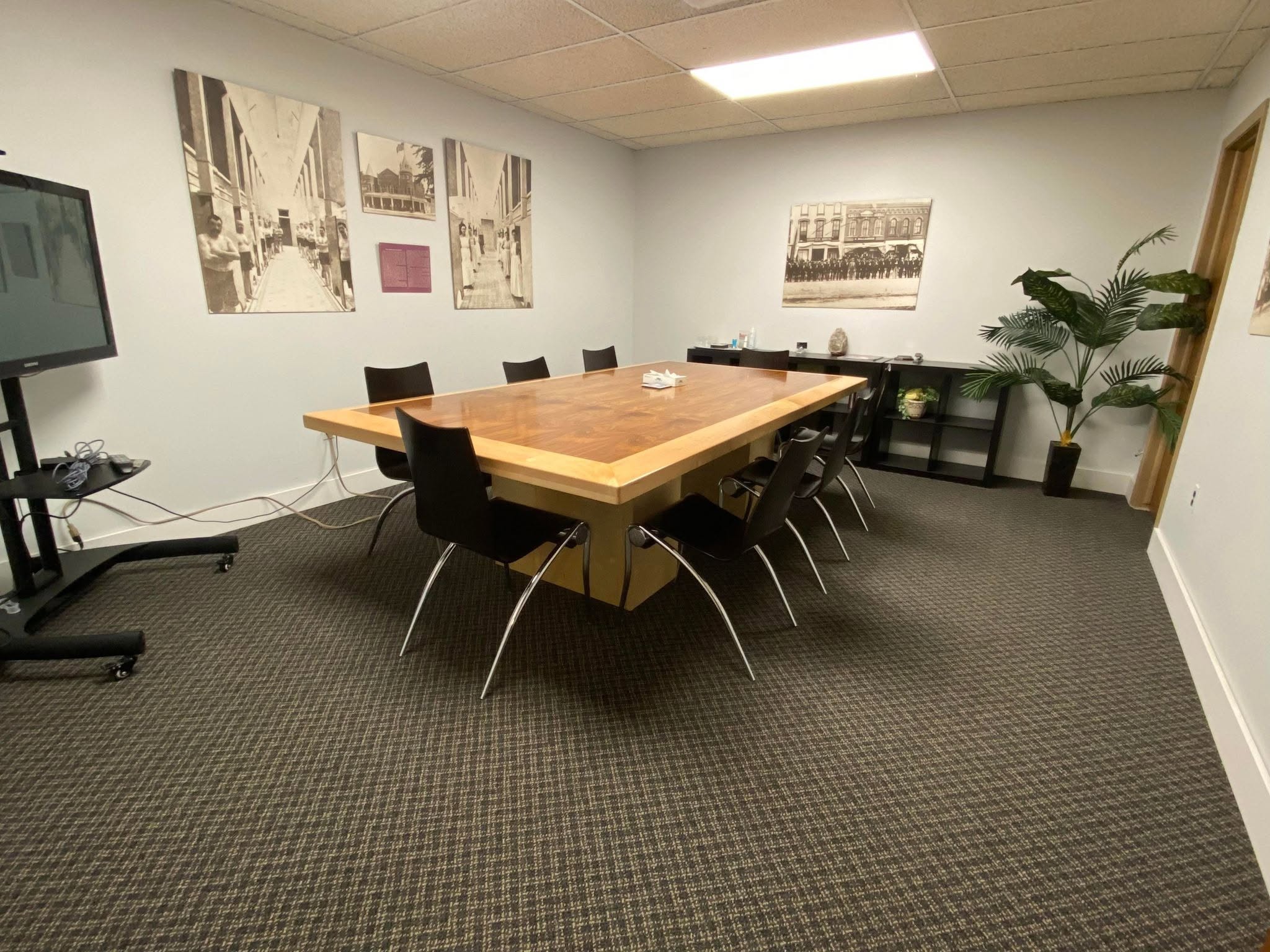 Conference room with large table and historic photos